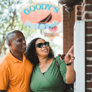 looking at the menu outside with Goody's Deli & Pub sign in the background